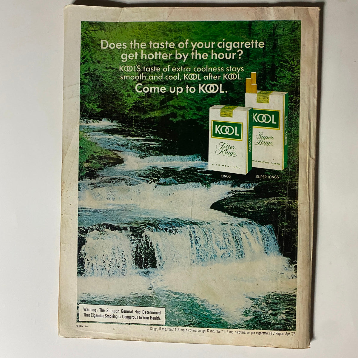 Back cover of VTG Popular Science Magazine August 1976 featuring an advertisement for KOOL cigarettes, showcasing a scenic waterfall backdrop. The ad highlights the 'extra coolness' of KOOL menthol cigarettes.
