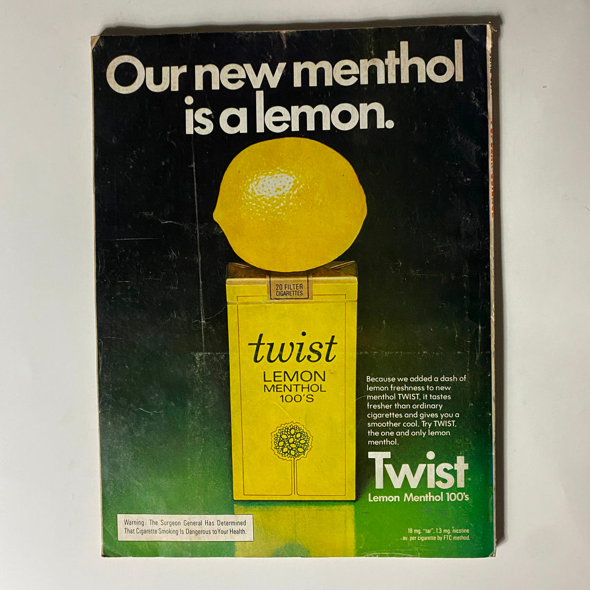 Back cover of the Popular Science Magazine June 1974, advertising Twist Lemon Menthol cigarettes, highlighting the unique lemon flavor and health warnings associated with smoking.