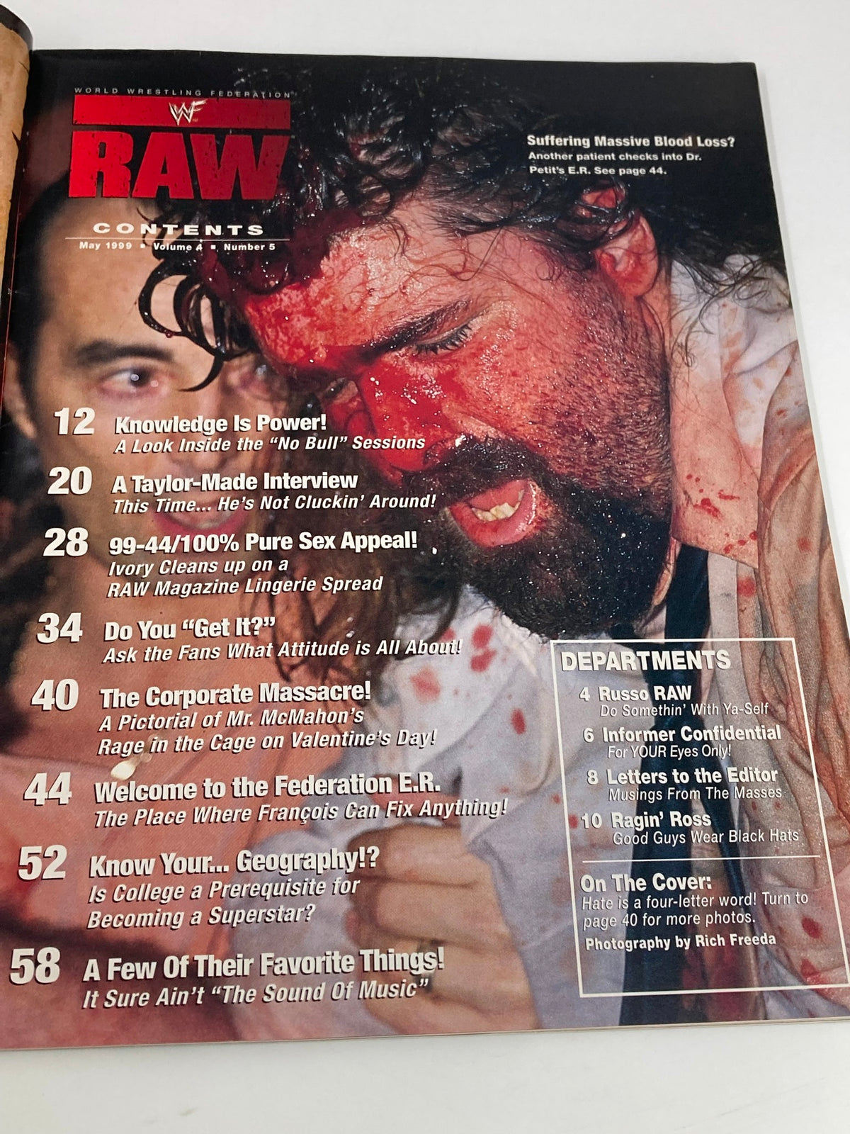 Contents page of WWF Raw Magazine May 1999 outlining articles and highlights, including a bloodied wrestler and various features.
