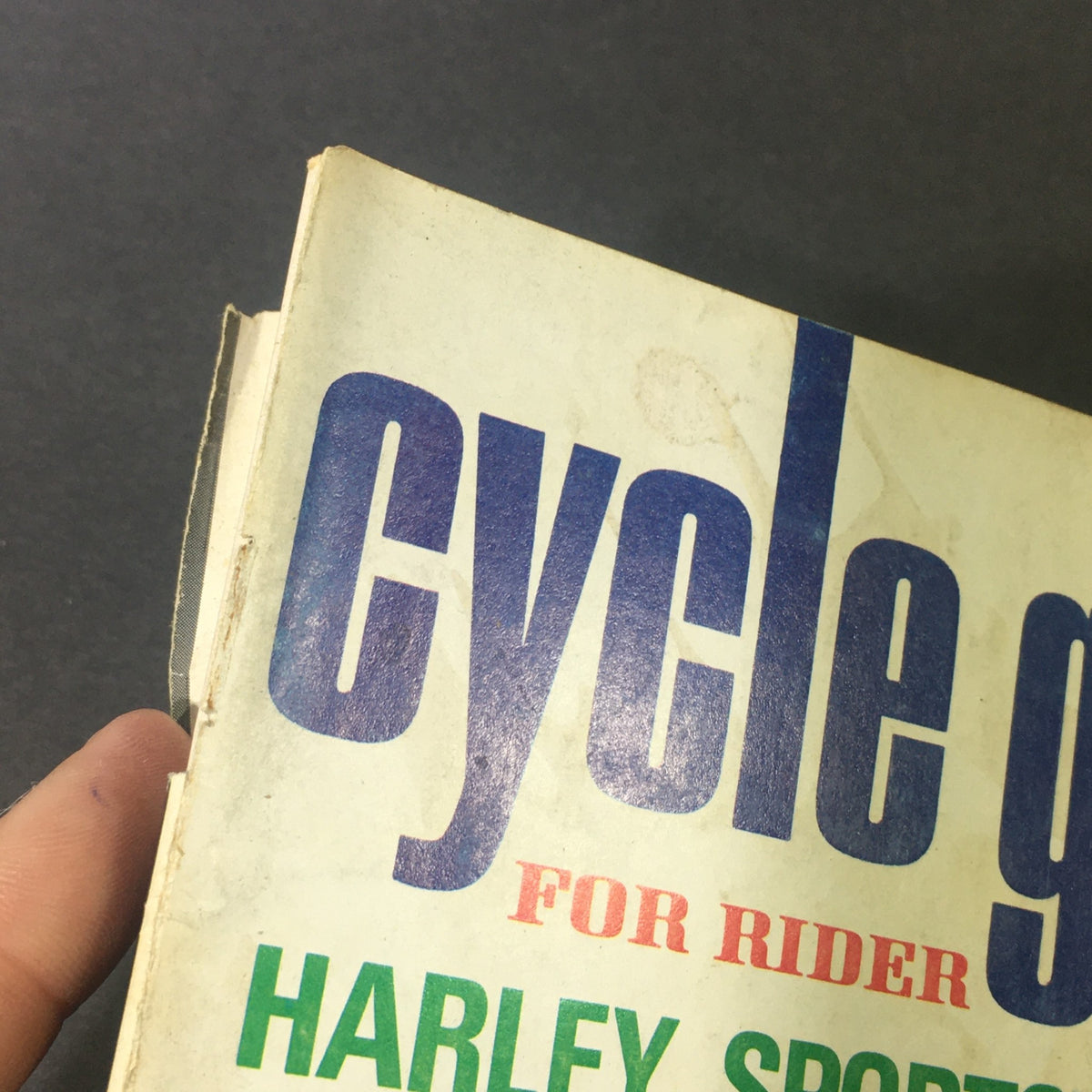Close-up image of the spine and top of the 'VTG Cycle Guide For Rider and Buyer June 1969', showing some wear and tear indicative of its vintage status.