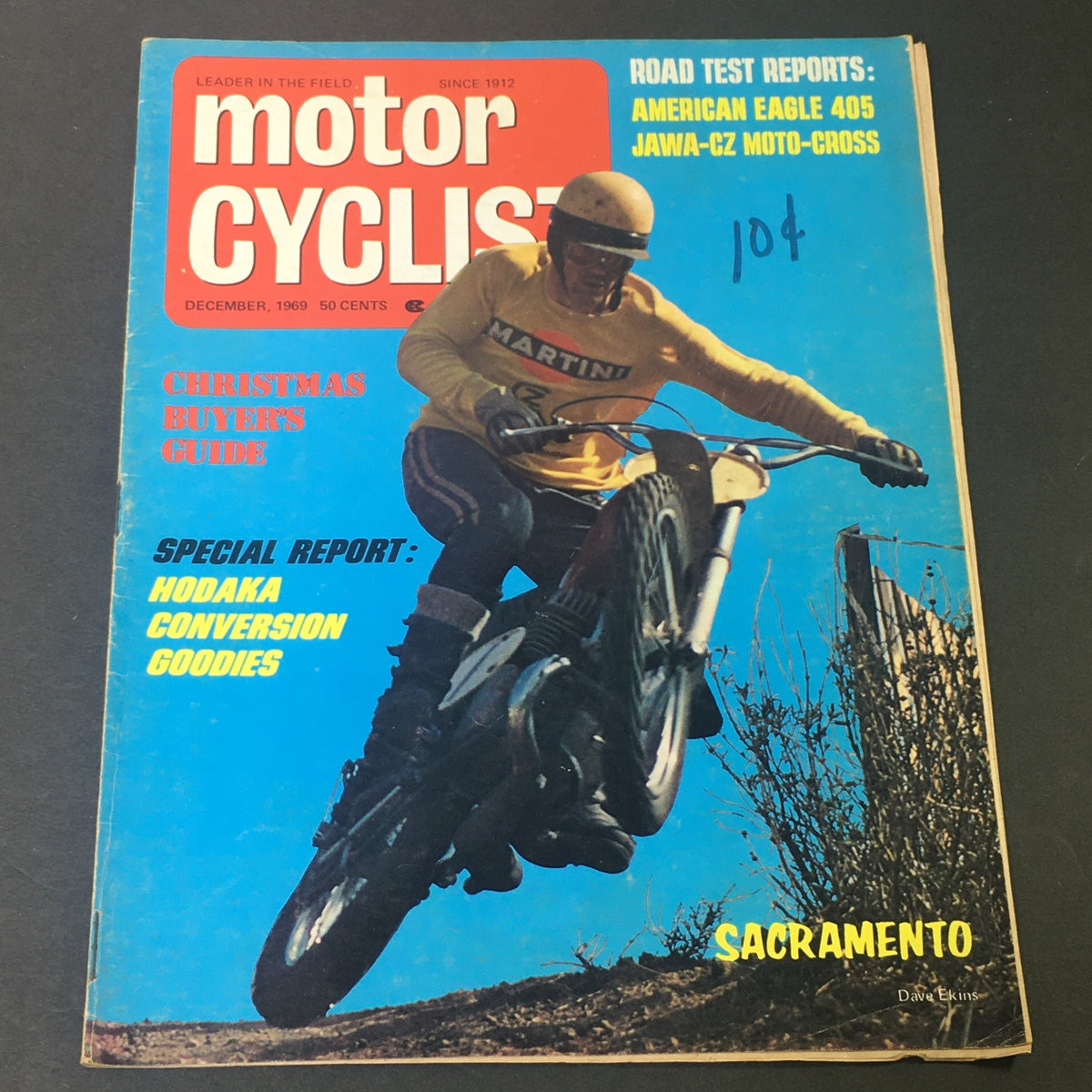 Cover of VTG Motor Cyclist Magazine December 1969 featuring a motorcyclist riding a Hodaka motorcycle with the title prominently displayed and focus on Christmas buyers guide and special reports.