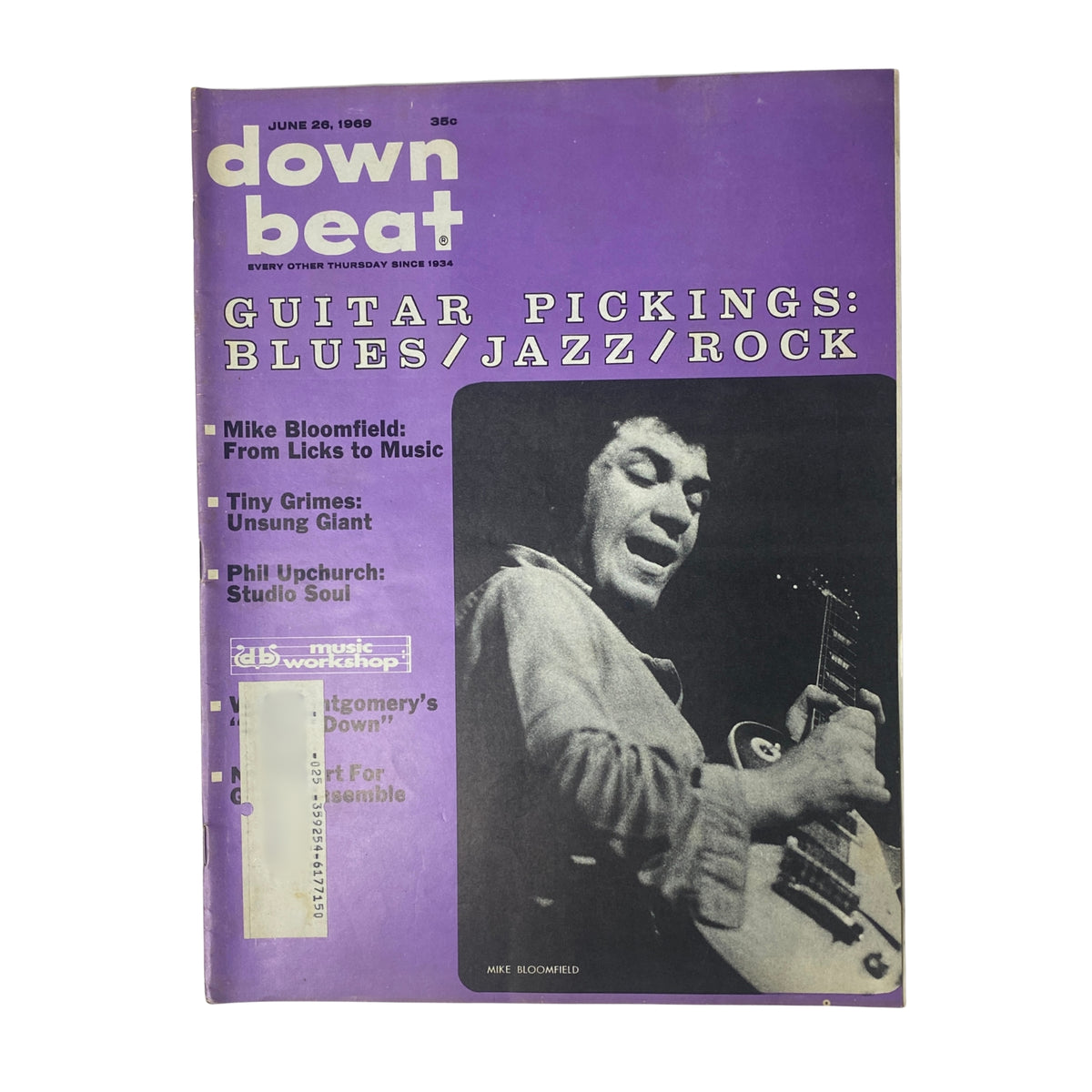 Cover of Down Beat Magazine from June 26, 1969 (Vol. 36 No. 13) featuring Mike Bloomfield. The magazine highlights guitar pickings in blues, jazz, and rock, showcasing interviews and articles related to prominent musicians of the era.