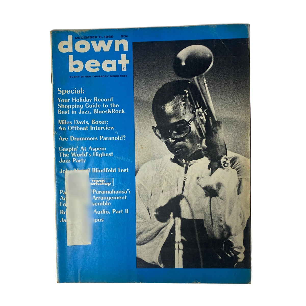 Cover of Down Beat Magazine December 11, 1969 Vol. 36 No. 25 featuring Miles Davis with a trumpet, showcasing a pivotal moment in jazz fusion history.