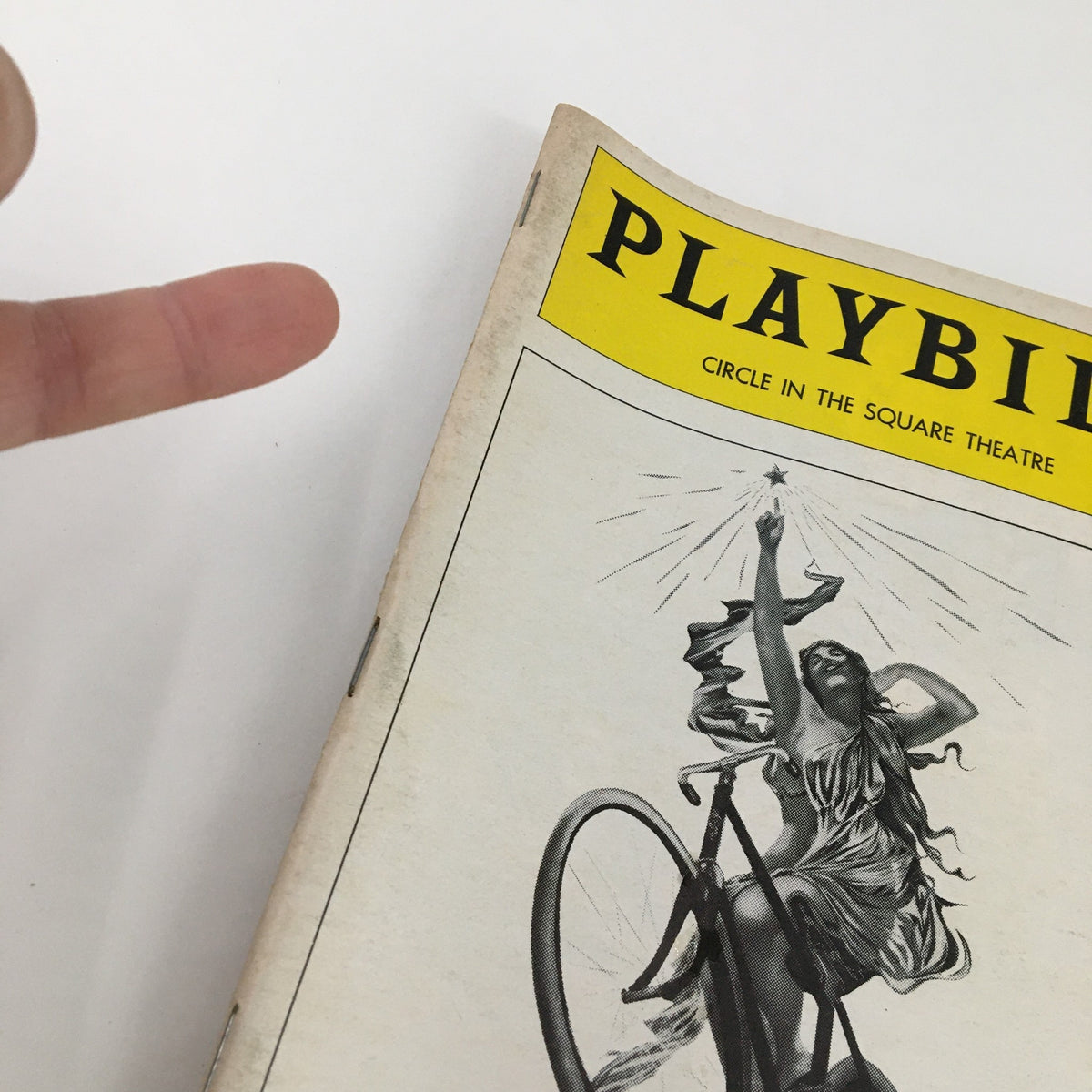 Close-up view of the 1979 Playbill for John Horton in Spokesong, focusing on the cover design and details.
