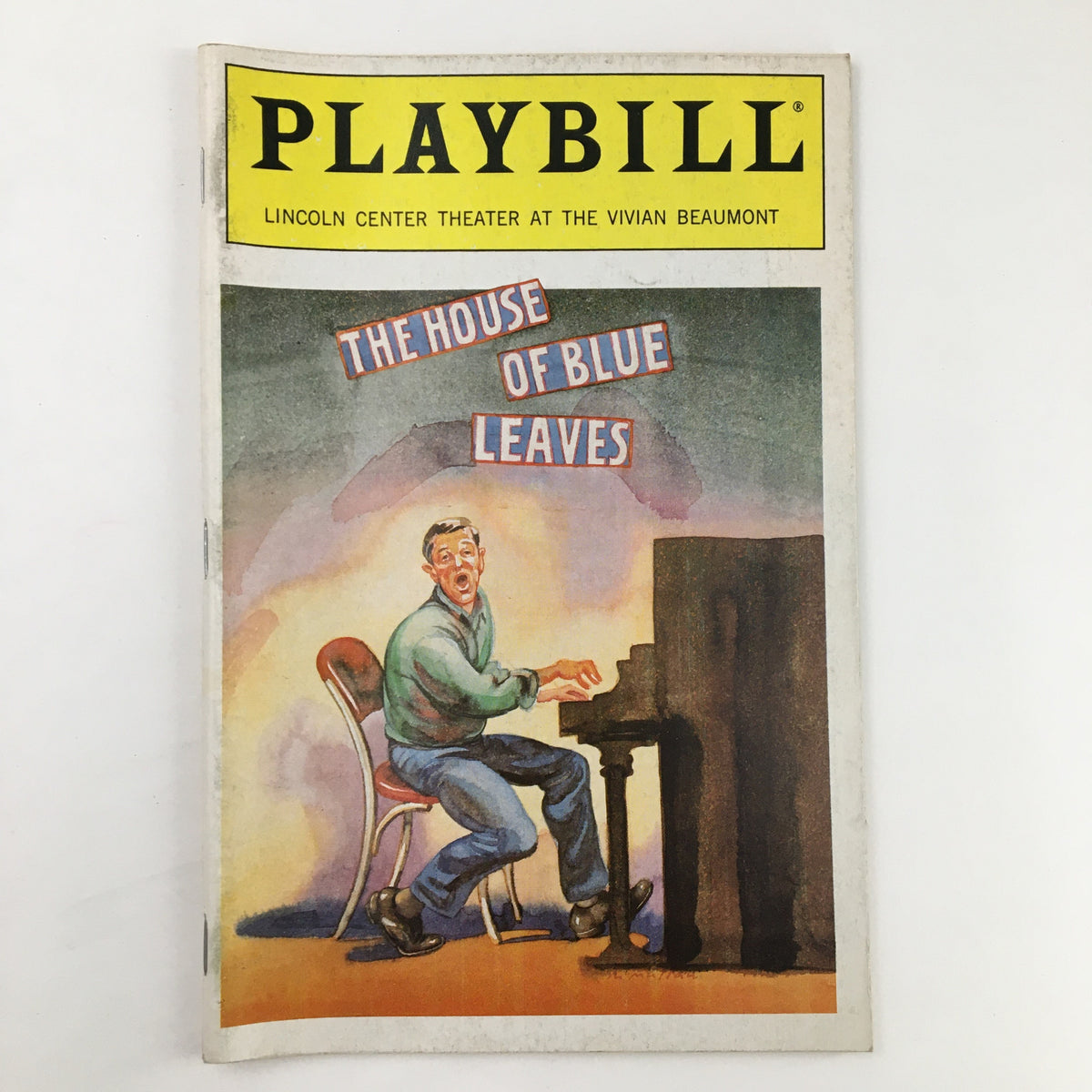 1986 Playbill for The House of Blue Leaves at Lincoln Center Theater, featuring colorful cover art with a character playing piano.