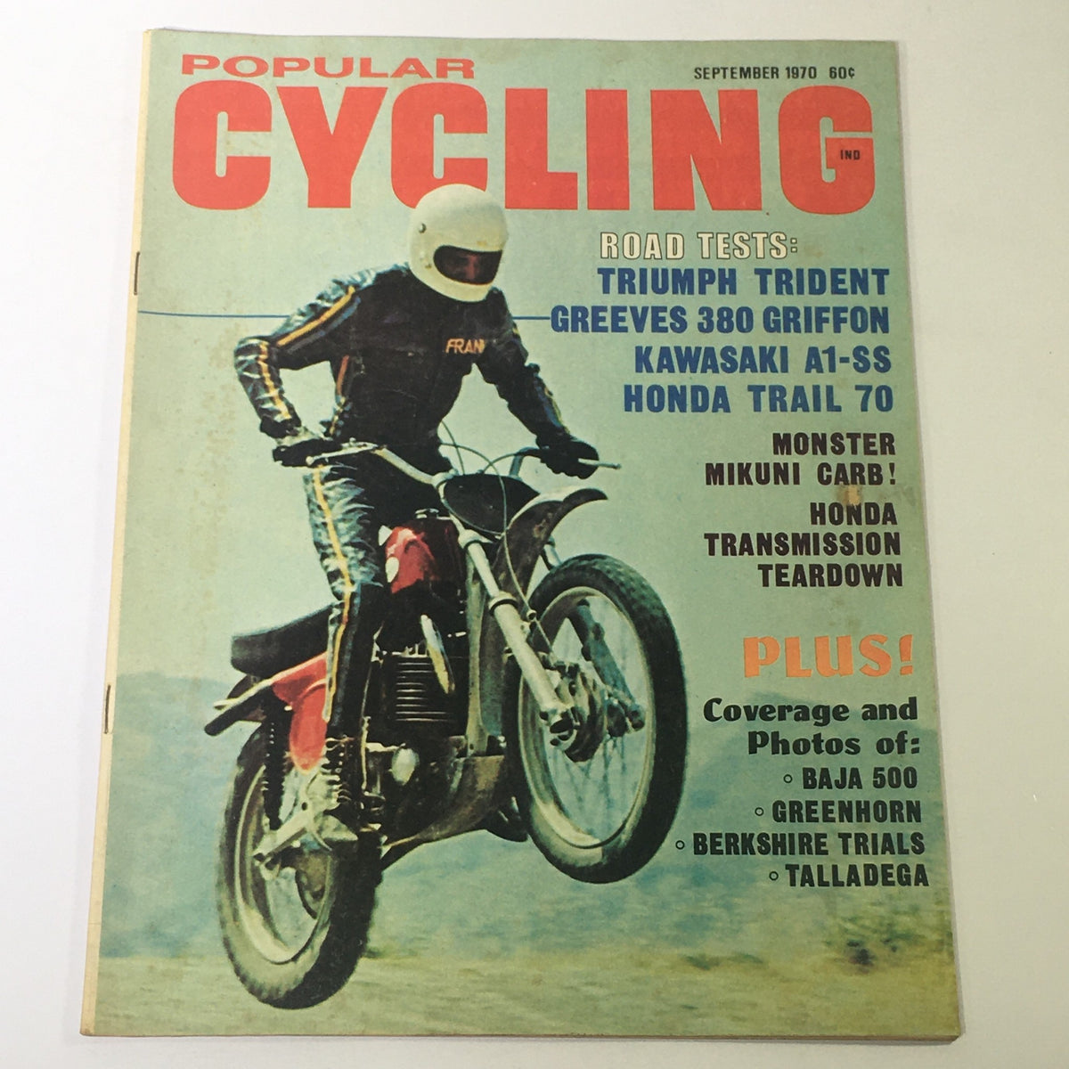 Cover of the VTG Popular Cycling Magazine from September 1970 featuring road tests of the Triumph Trident and Greeves 380, showcasing motorcycle culture with vivid imagery and bold text.