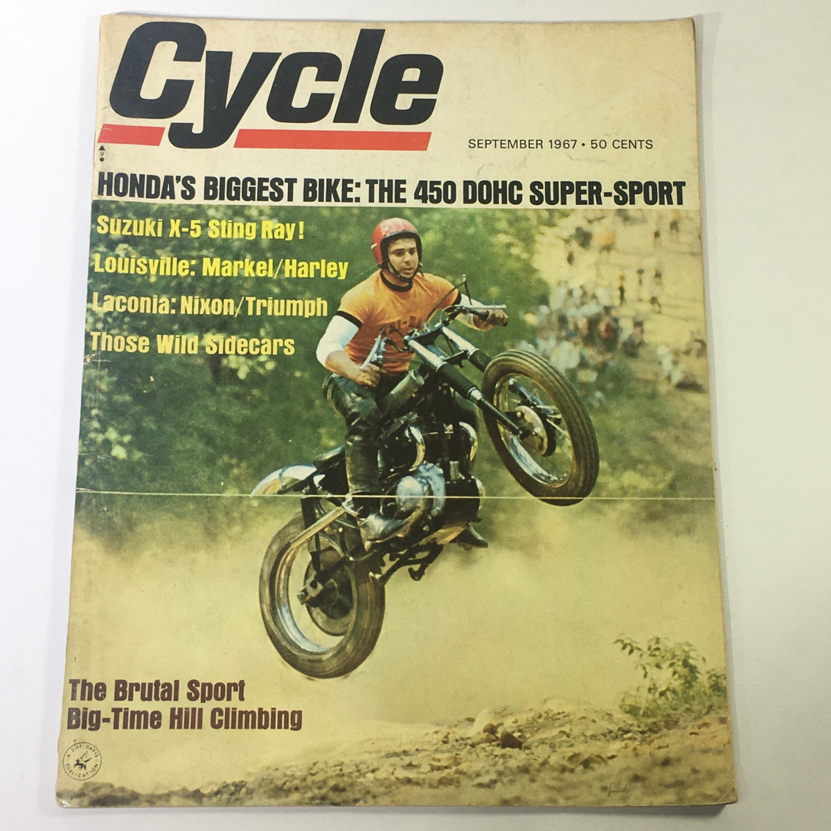 VTG Cycle Magazine September 1967 featuring the Suzuki X-5 Sting Ray and Honda 450 DOHC Sport, showcasing a motorcyclist performing a stunt with a vintage motorcycle in a dirt setting.