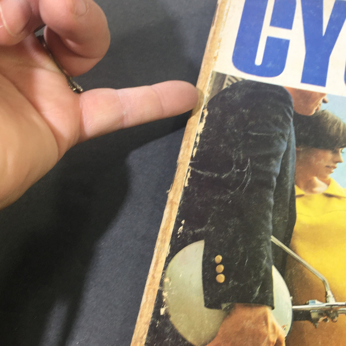 Close-up of the cover edge of VTG Cycle Guide Magazine May 1967, showcasing the vintage style and condition of the magazine, highlighting motorcycle content.