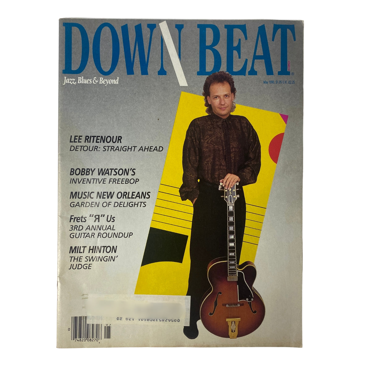 Cover of Down Beat Magazine May 1990 featuring guitarist Lee Ritenour and saxophonist Bobby Watson. The colorful design highlights Ritenour's performance in 'Straight Ahead' and mentions Watson's 'Inventive Freebop'.