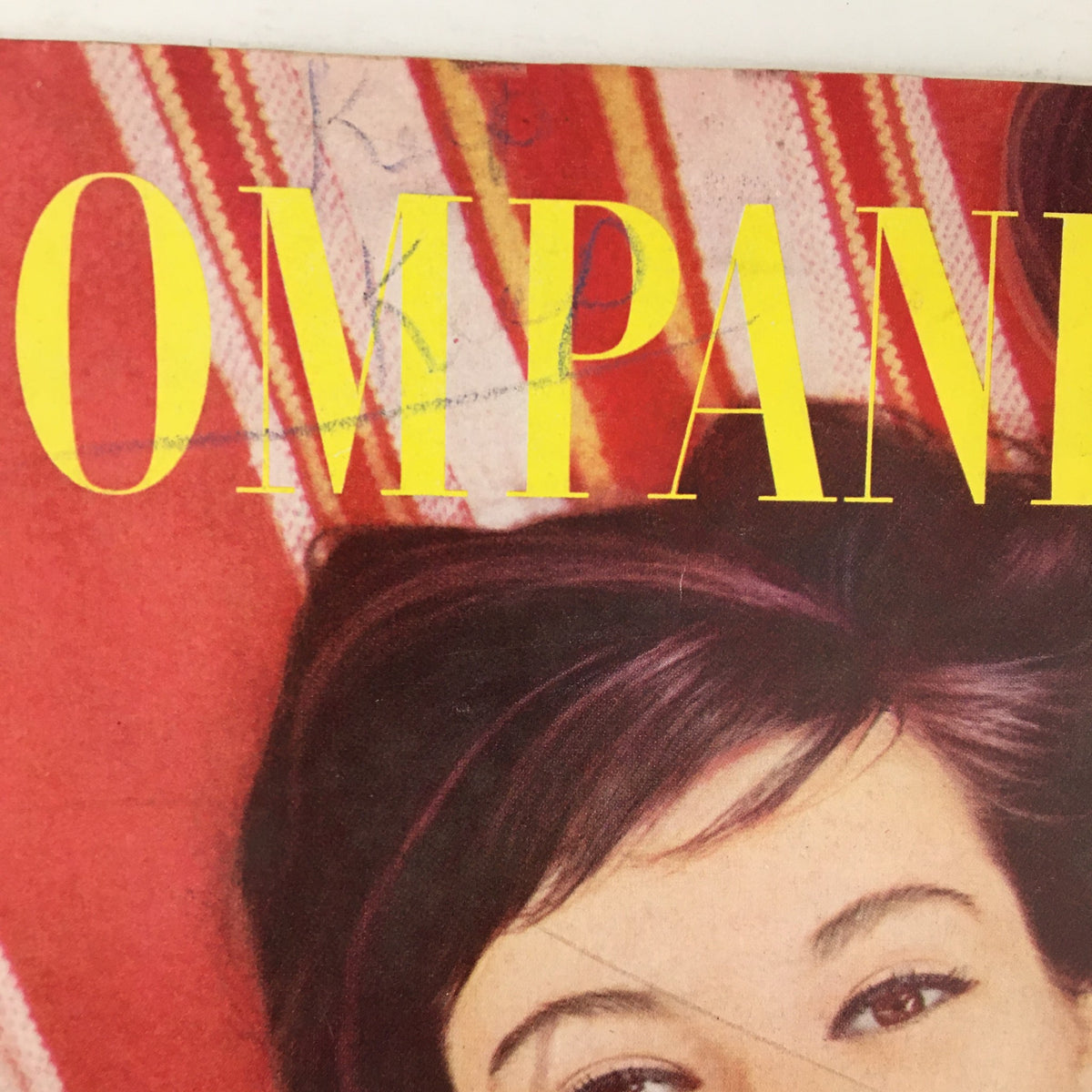 Close-up of the title 'COMPANION' from the cover of Woman's Home Companion Magazine August 1956, emphasizing the vintage design and bright colors.