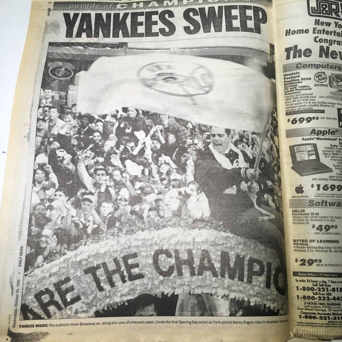 Another section of the NY Daily News from October 30, 1996, displaying a photo of enthusiastic fans at the Yankees celebration parade with the headline 'YANKEES SWEEP'.