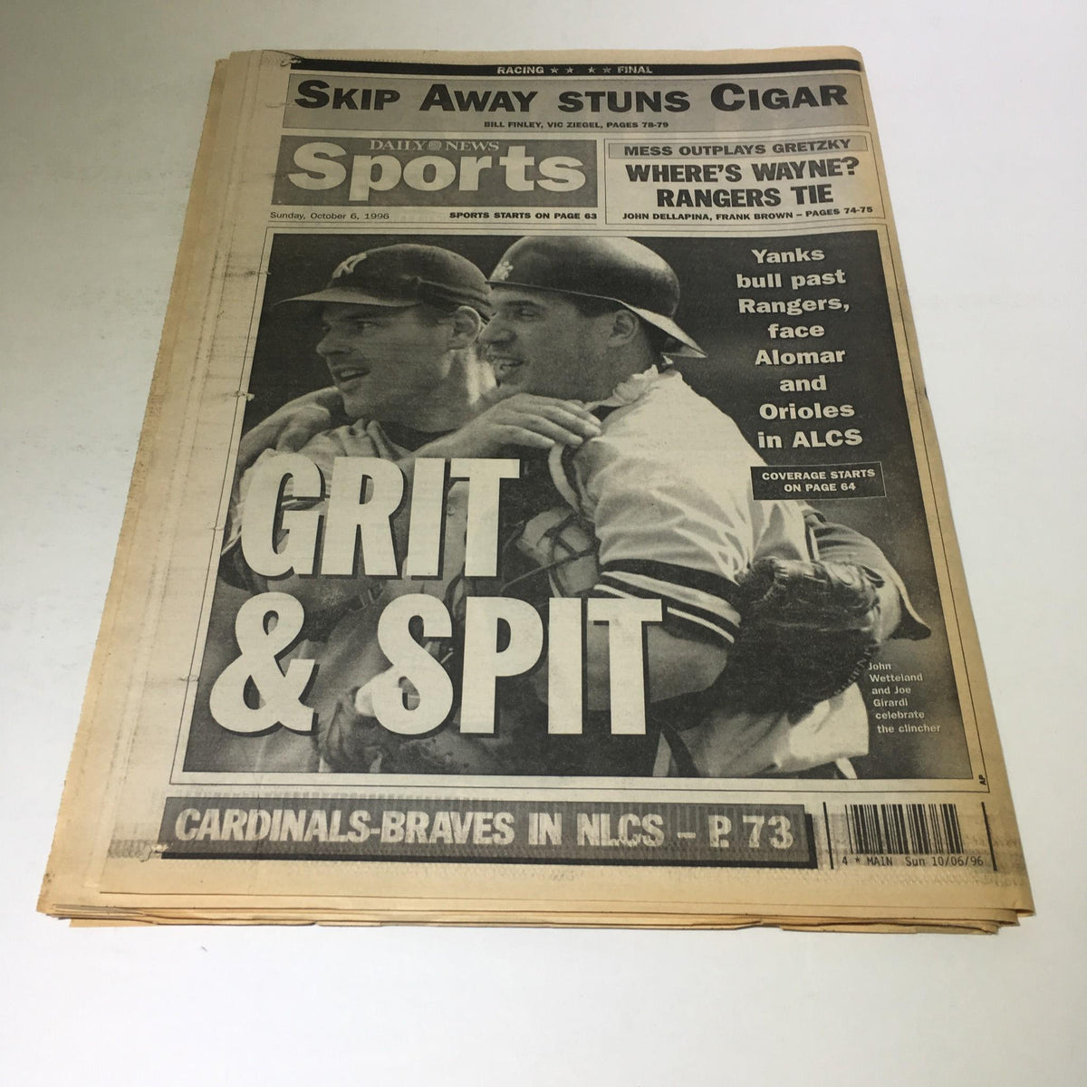 Front cover of the NY Daily News vintage magazine dated October 6, 1996, with the title 'Grit & Spit' and highlights of the Yankees' victory over Texas, capturing a significant moment in sports history.