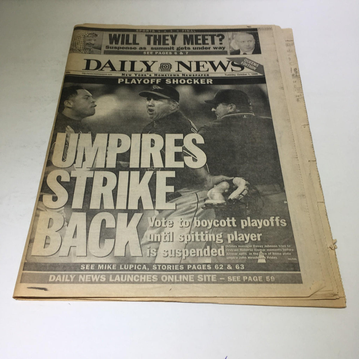 New York Daily News headline from October 1, 1996, featuring the article 'Umpires Strike Back' about the decision to boycott playoffs until a spitting player is suspended.