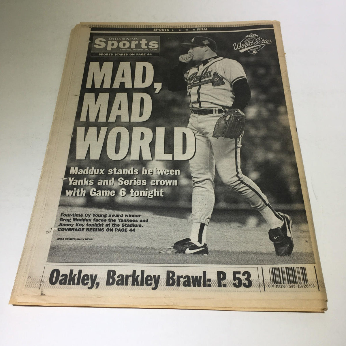 New York Daily News front page titled 'Mad, Mad World', featuring a headline about Game 6 of the World Series, details of the Yankees and player Maddux. Date: October 26, 1996. Win It For Frank.