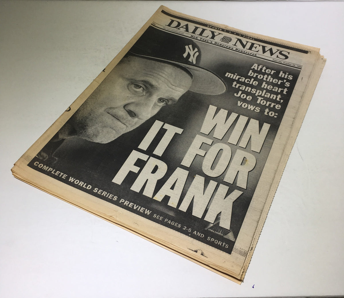 New York Daily News front page titled 'WIN IT FOR FRANK', showcasing an emotional photo of Yankees manager Joe Torre related to his brother's health, date October 26, 1996. Complete World Series preview.