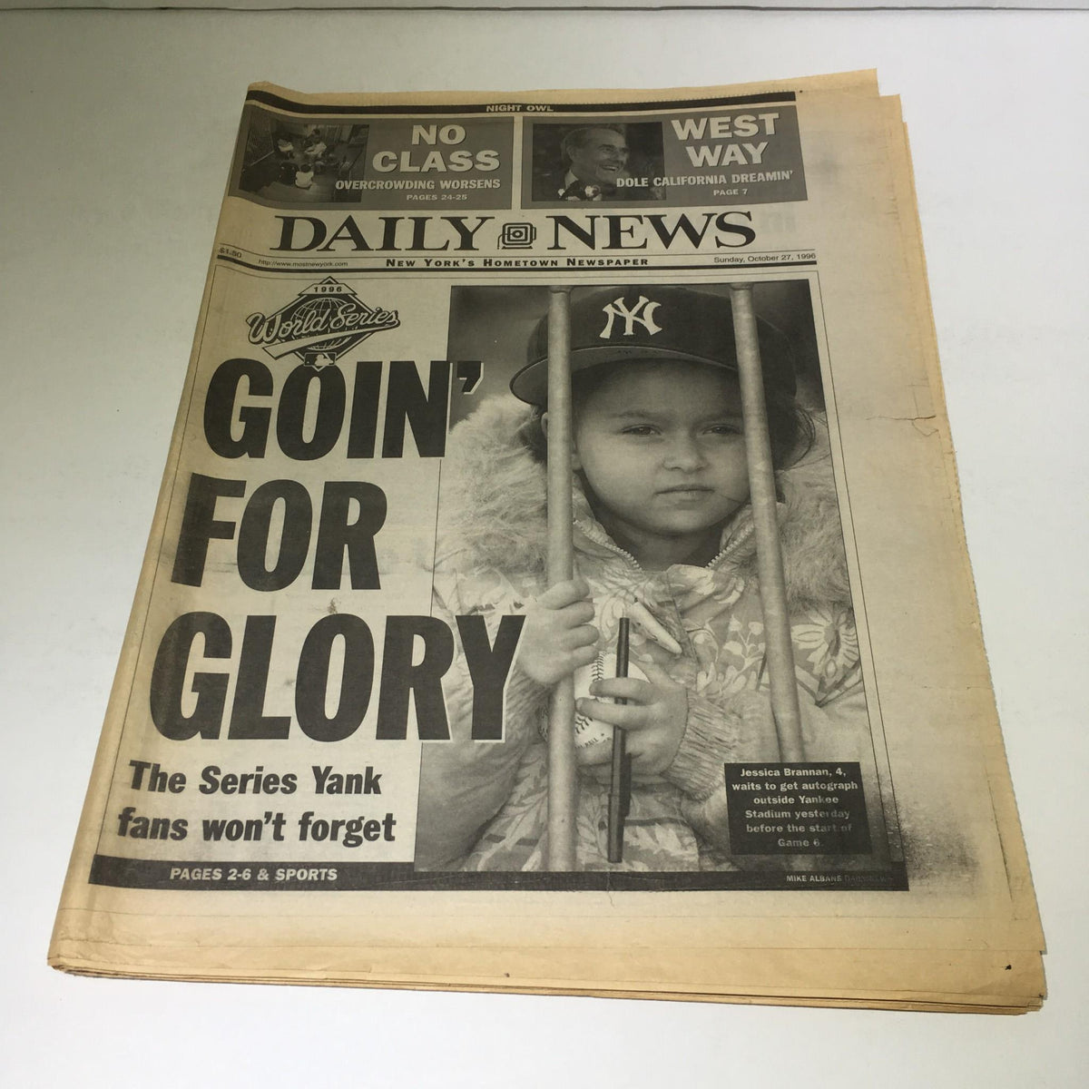 Front page of the New York Daily News from October 27, 1996, featuring the title 'Goin' For Glory' with an image of a young girl holding a baseball bat, representing fan spirit for the World Series.