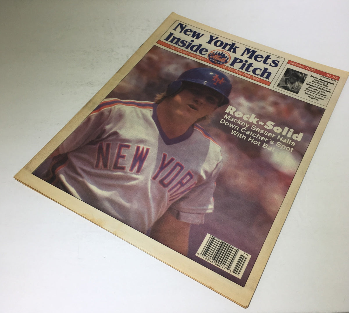 Mets Newspaper from October 1990 featuring Mackey Sasser, captioned 'Mackey Sasser Nails Down Catcher's Spot w/ Hot Bat'. This collectible sports magazine highlights Sasser's performance and includes vibrant imagery relevant to baseball.