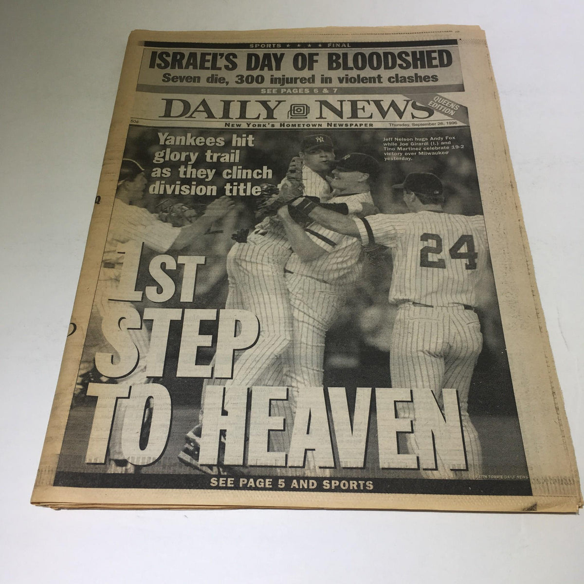 New York Daily News front page from September 26, 1996, featuring the headline '1st Step to Heaven' along with coverage of the Yankees clinching the division title.