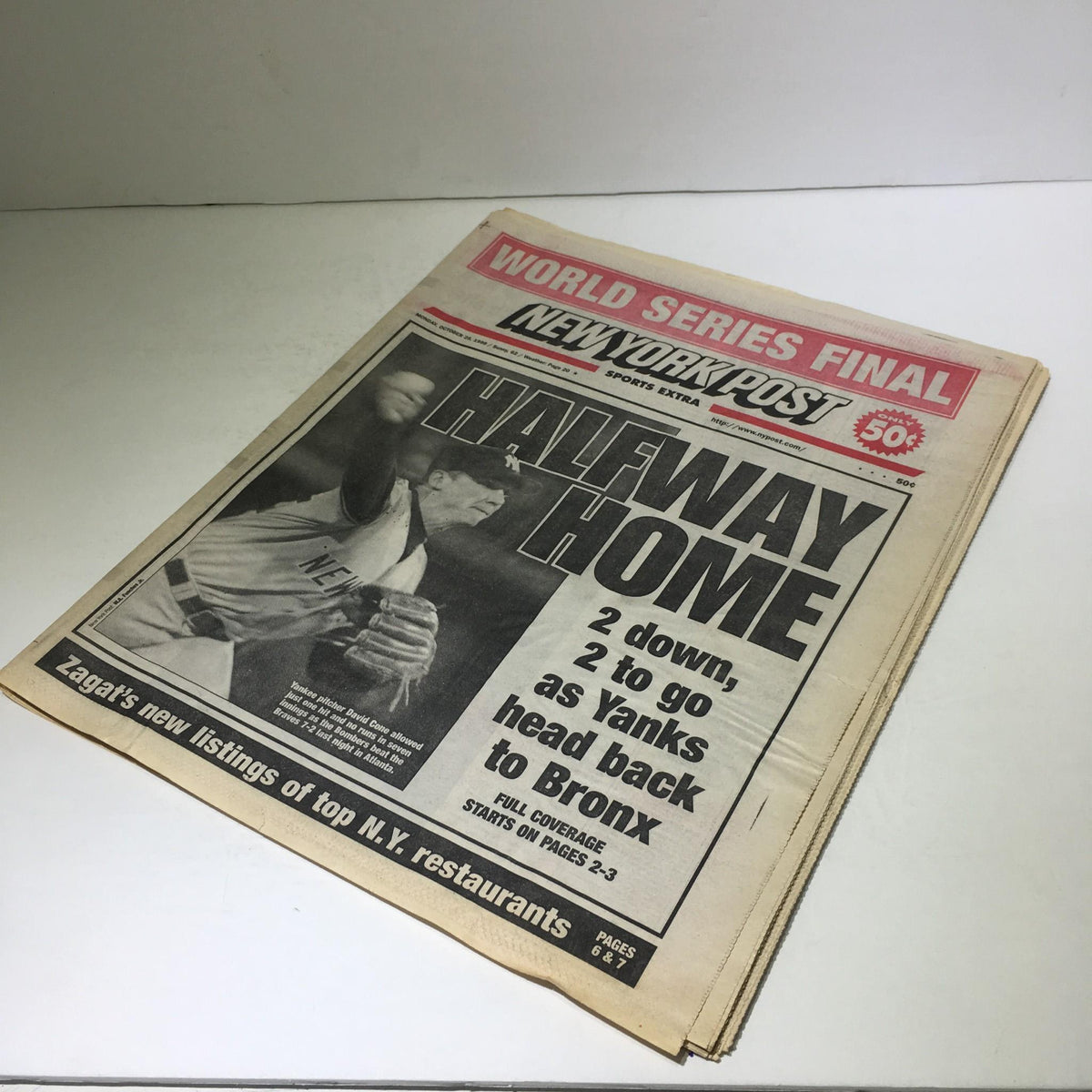 Cover of the NY Post dated October 25, 1999, with the headline 'HALFWAY HOME' detailing the Yankees' series progress, connected to 'NY Post: October 25 1999 Halfway Home 2 Down 2 To Go As Yanks Head Back To Bronx.'