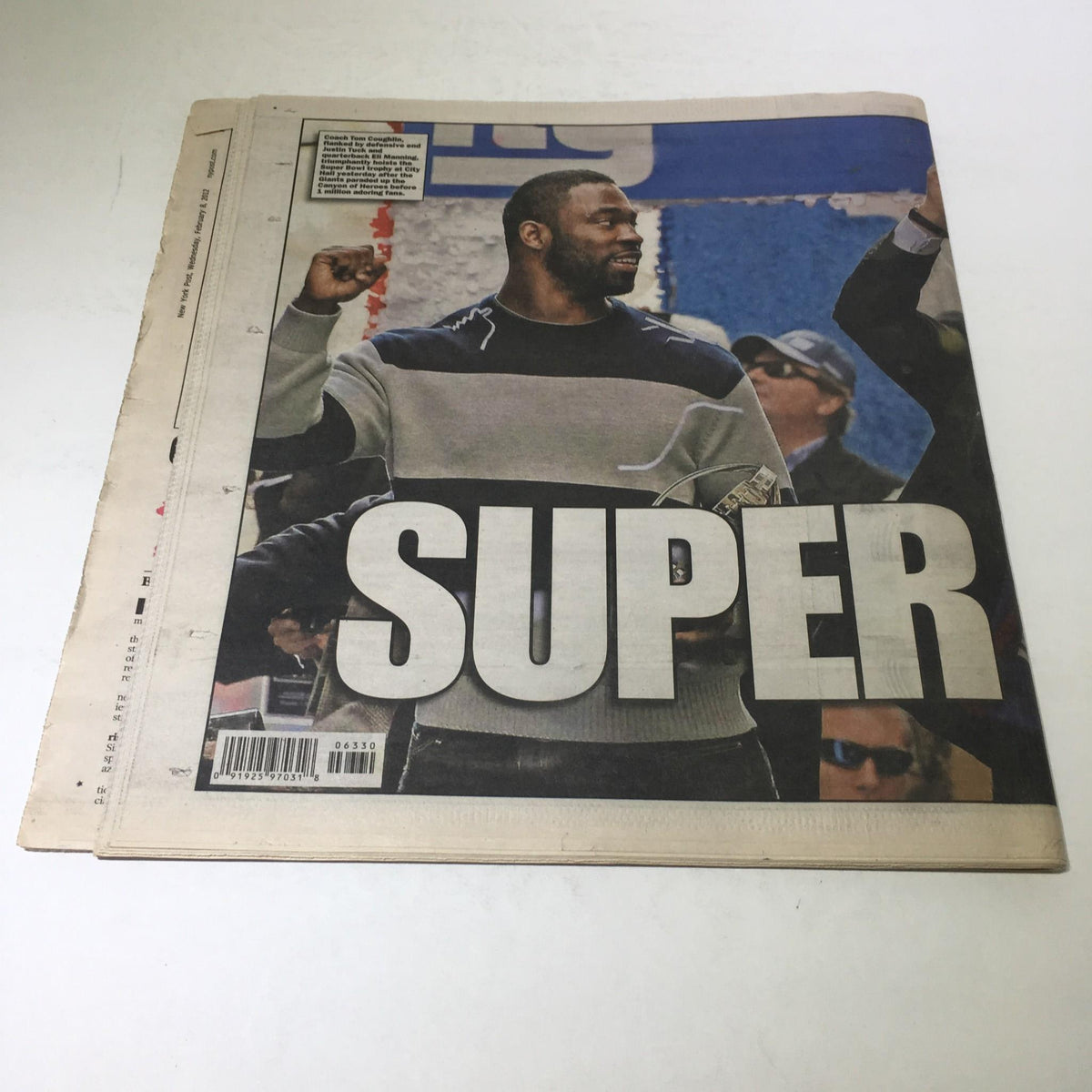 Cover of the New York Post from Feb 8, 2012, featuring the word 'SUPER' in bold, honoring the champion Giants with celebratory imagery.