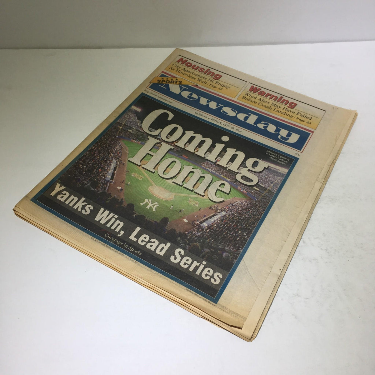 Newsday newspaper from October 25, 1996, featuring the headline 'Coming Home, Yanks Win, Lead Series'. The cover showcases aerial views of a baseball field with fans in the stands.