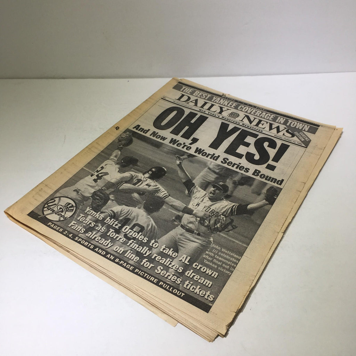 NY Daily News: 10/14/96 J.Wetteland Celebrates with Teammates After Yankee Victory. The vintage newspaper features the headline 'OH, YES!' with an image capturing jubilant New York Yankees players celebrating their advancement to the World Series.