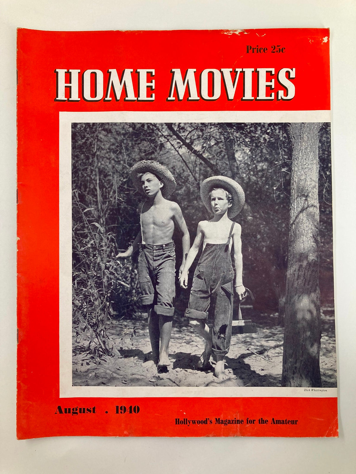 Vintage Home Movies Magazine cover from August 1940, featuring two boys in straw hats walking through nature, showcasing the magazine's title and retro design.