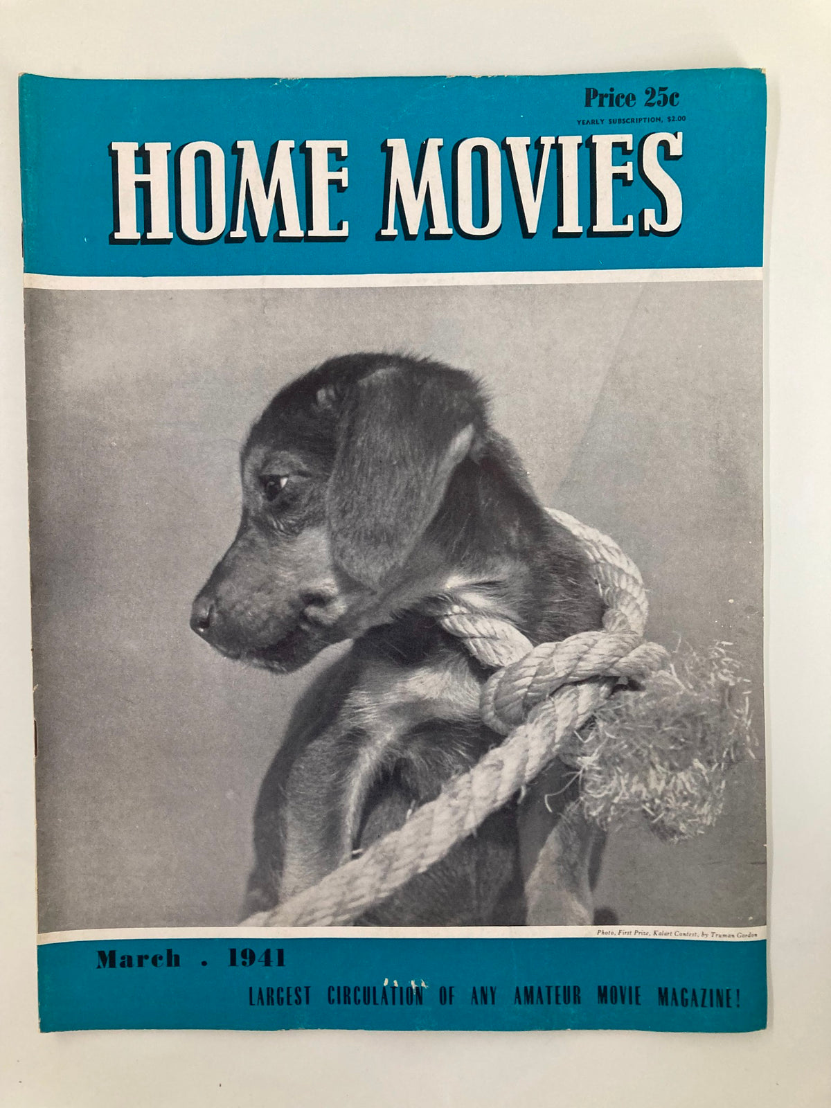 Cover of VTG Home Movies Magazine March 1941 featuring a prize-winning photograph by Truman Gordon, showcasing a dog with a rope.
