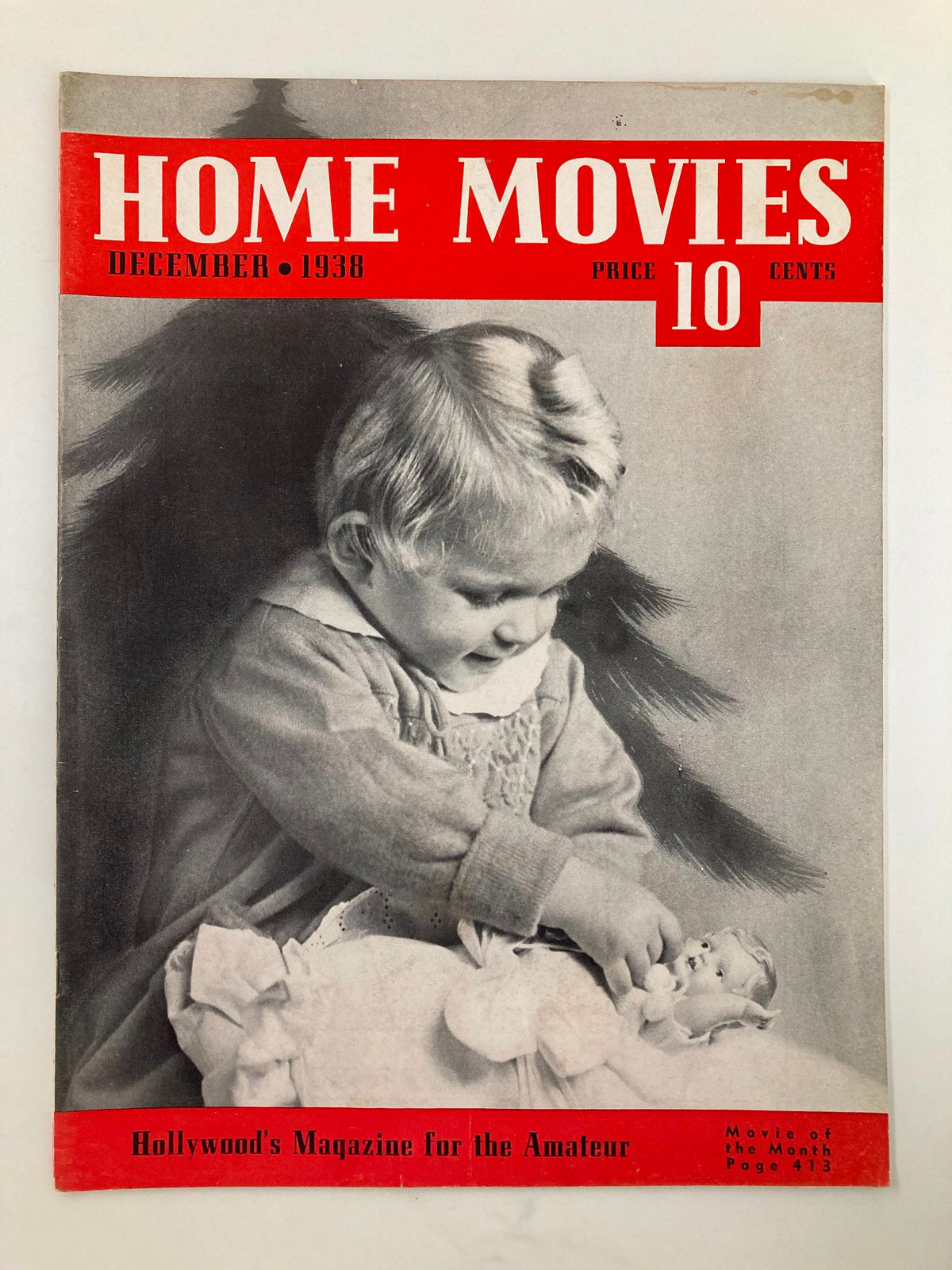 VTG Home Movies Magazine December 1938 cover featuring a child with a doll, celebrating home videography and nostalgia.