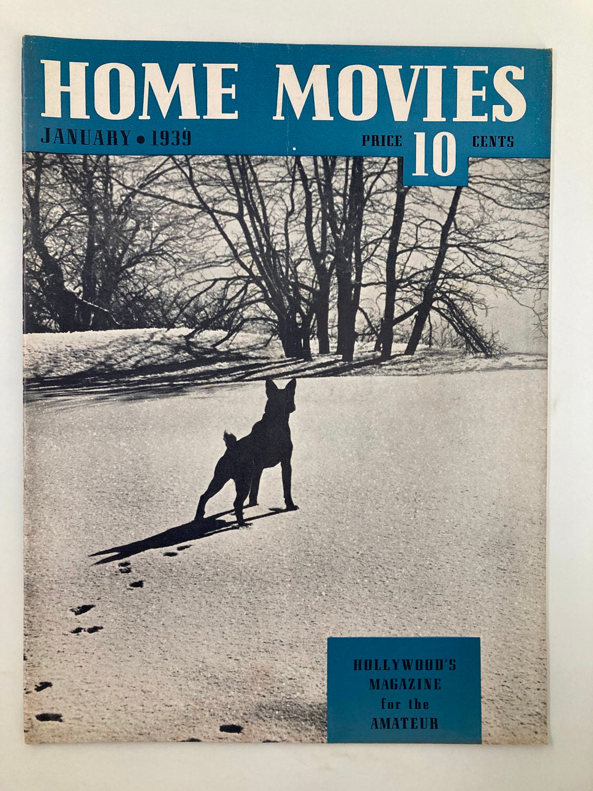 Cover of VTG Home Movies Magazine January 1939 featuring a silhouette of a dog in a snowy landscape, highlighting its historical significance in classic cinematography.