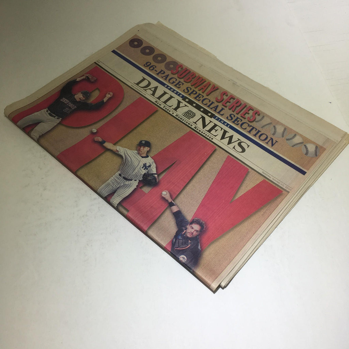 NY Daily News: Oct 21 2000 Play Ball! Special Section showcasing baseball action with iconic players captured in mid-throw on the front page.