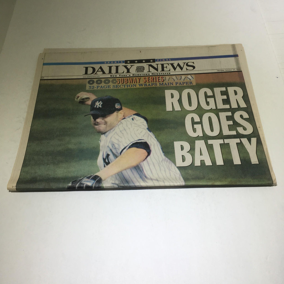 Featured image from the NY Daily News October 23, 2000, titled 'Roger Goes Batty,' highlighting Roger Clemens during a pitch in the Subway Series.
