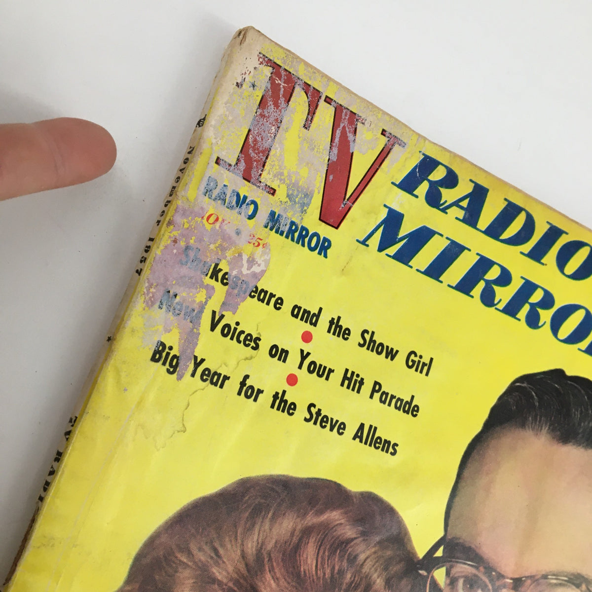 Close-up of the top portion of the TV Radio Mirror Magazine November 1957 cover, highlighting the title and some text, showing signs of wear typical for vintage magazines.