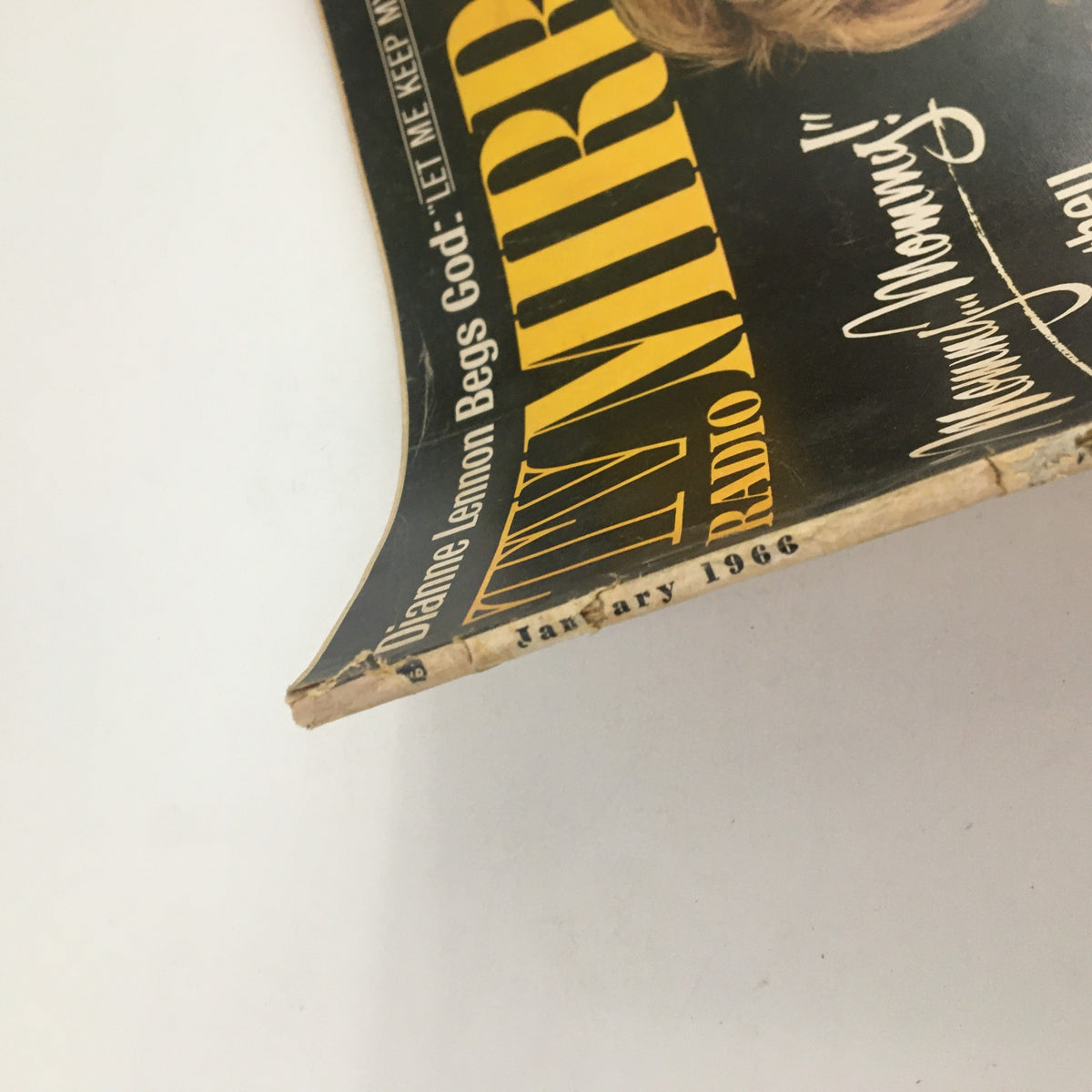 Detailed view of the edge of the TV Radio Mirror magazine from January 1966, showcasing the vintage condition and iconic design elements of the magazine.