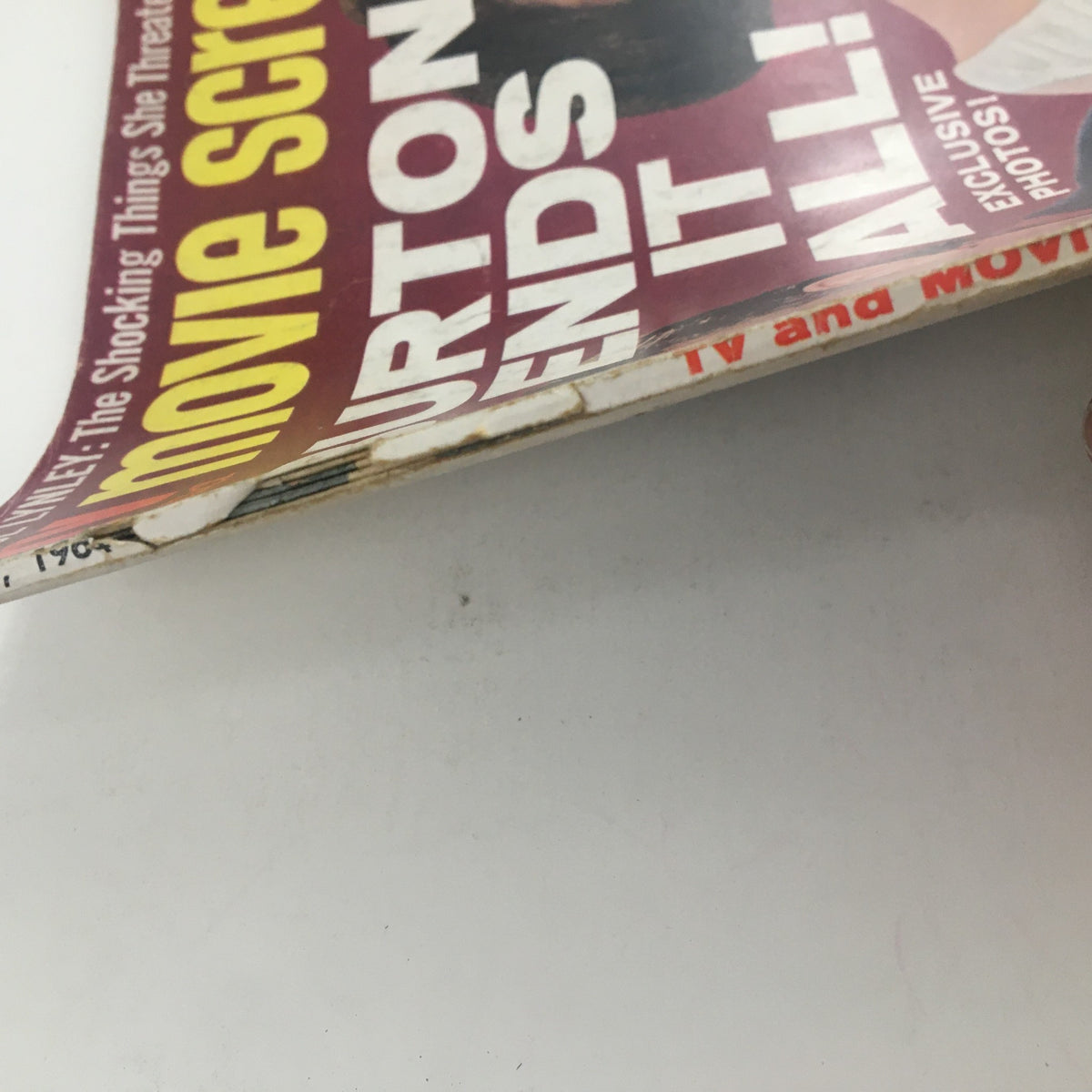 Bottom view of TV and Movie Screen Magazine February 1964 displaying details of the issue and visibility of the magazine title featuring Liz Taylor and Richard Burton.