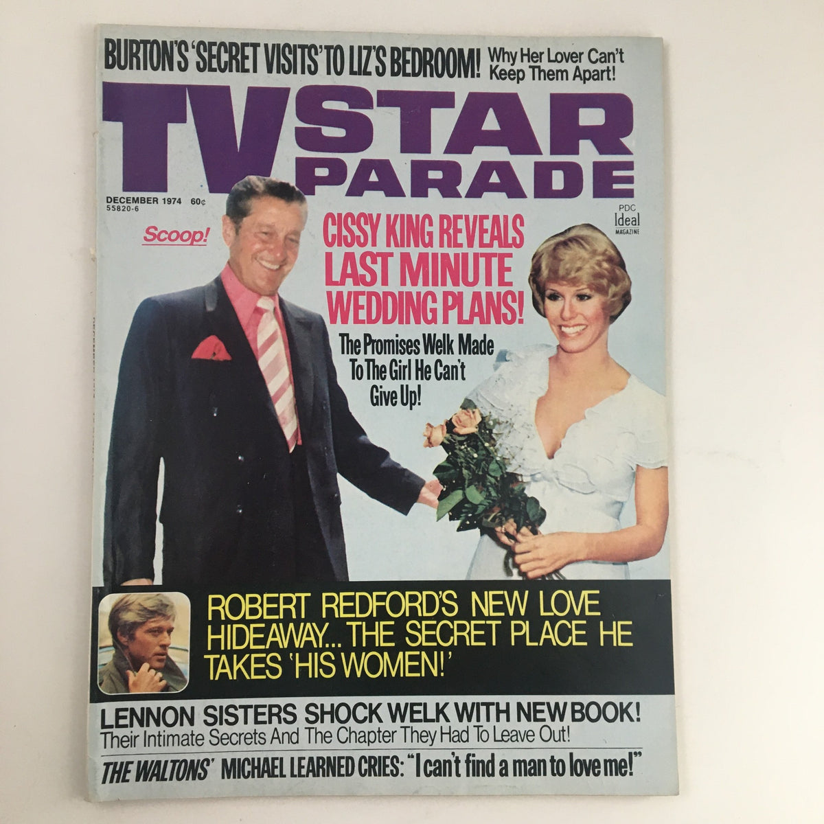 Cover of TV Star Parade Magazine December 1974 featuring iconic stars Liz Taylor and Robert Redford, showcasing retro Hollywood glamour and cultural insights from the 1970s.
