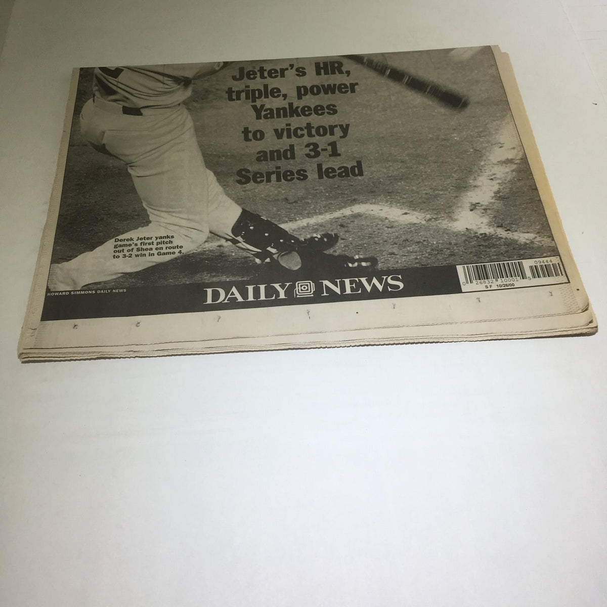 Detailed view of NY Daily News article on Yankees' victory, emphasizing Derek Jeter's contributions with his HR and triple, part of the 3-1 series lead.