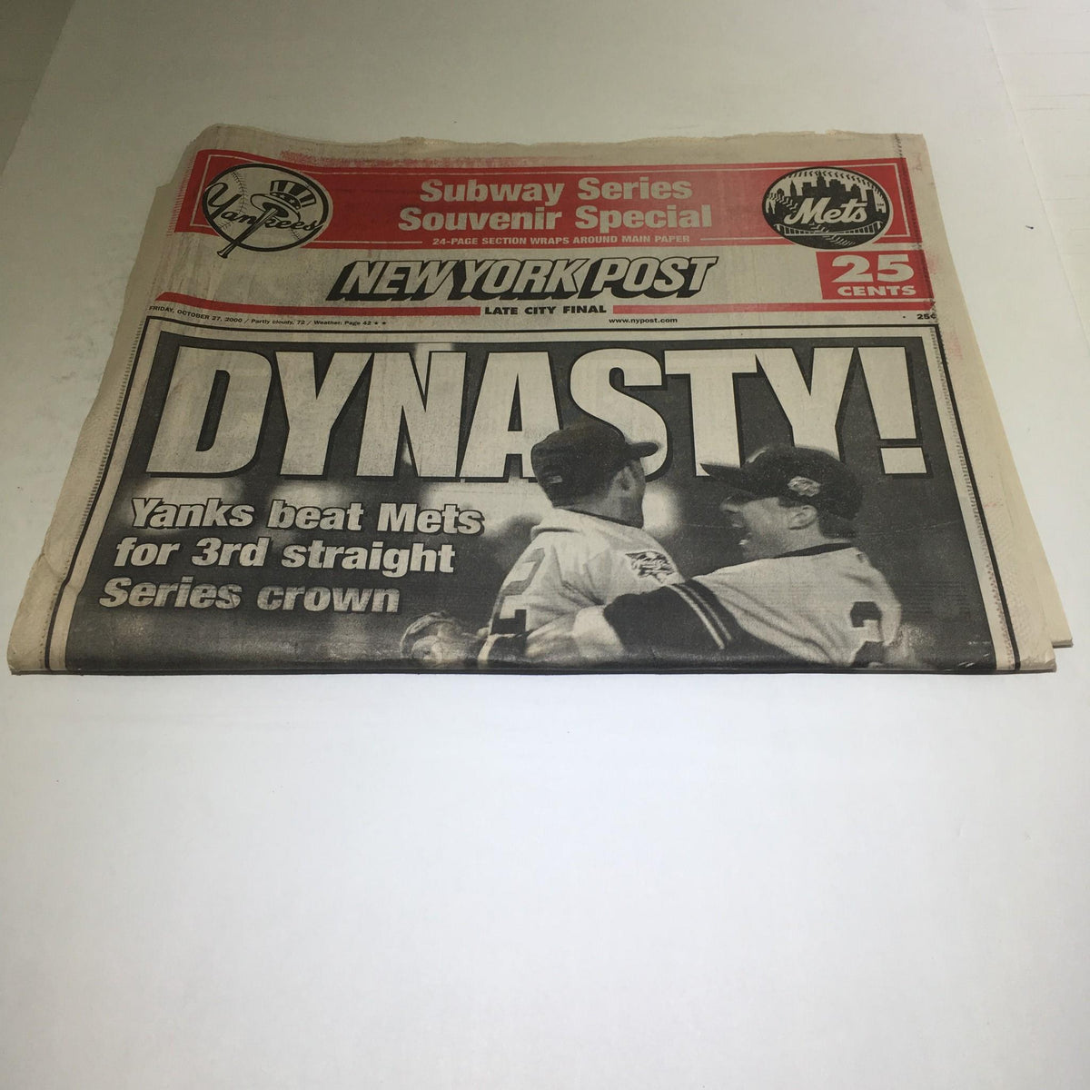 Another view of the vintage New York Post newspaper with the headline 'Dynasty! Yanks Beat Mets For 3rd Straight Series Down,' showcasing the significance of the Yankees' win.