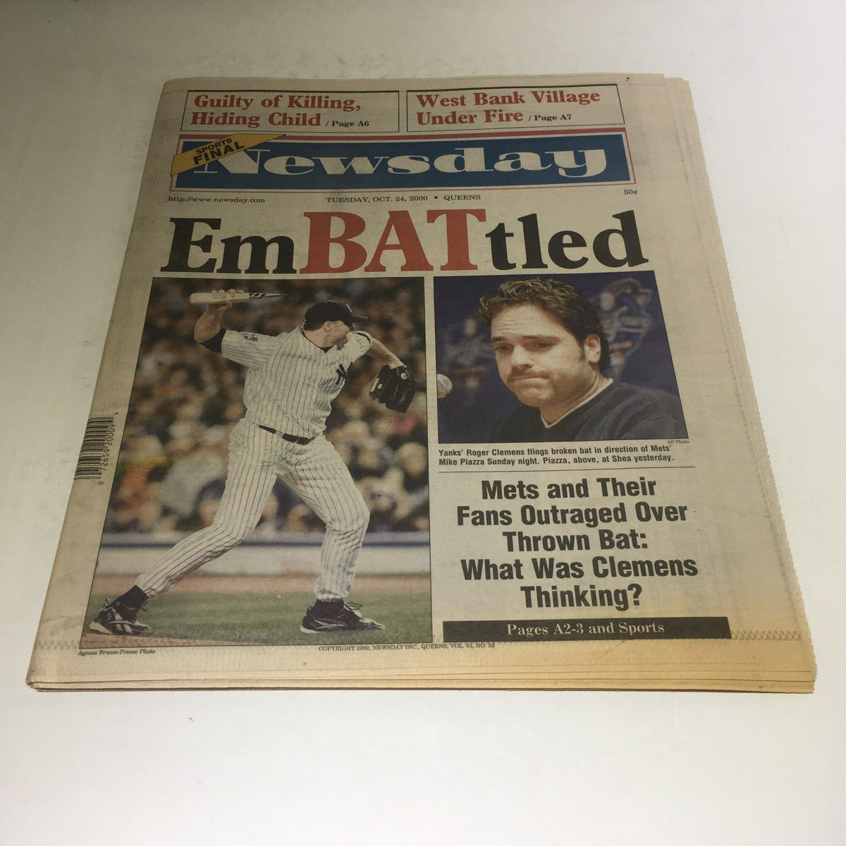 Front page of Newsday, dated October 24, 2000, featuring the title 'EmBATtled' with a prominent image of a baseball player in action and commentary about the Mets and Yankees.