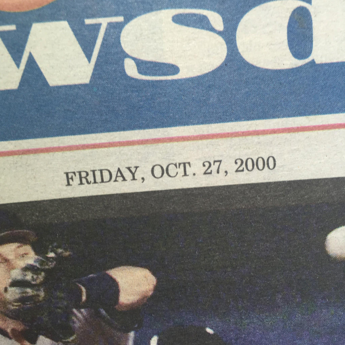 Close-up of the date 'Friday, Oct. 27, 2000' on the front page of Newsday, associated with the 'Triple Crown' headline.