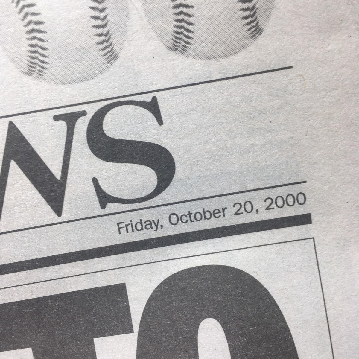 Close-up of the NY Daily News dated Friday, October 20, 2000, highlighting the date prominently as part of the newspaper issue.