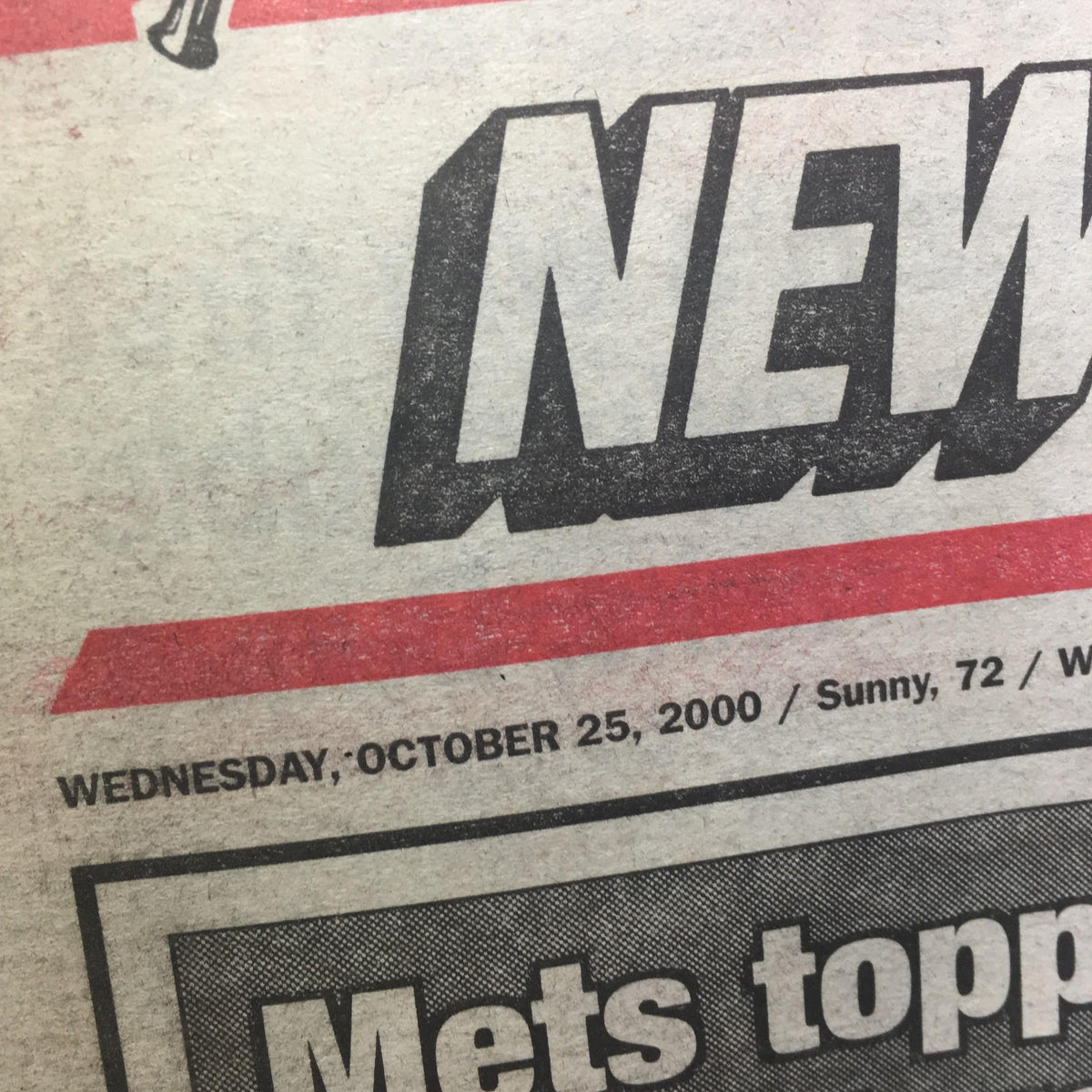 NY Post: 10/25/2000 Mets topple Yanks, El Duque to capture Game 3 - Close-up of the newspaper header with the date, Wednesday, October 25, 2000.