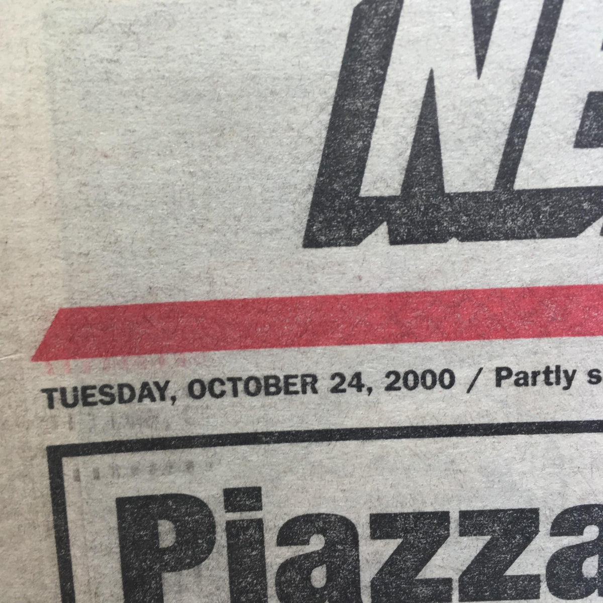 Close-up of the New York Post date showing 'Tuesday, October 24, 2000' along with the newspaper headline 'Piazza rips into Rocket' relevant to the Bleep Show.