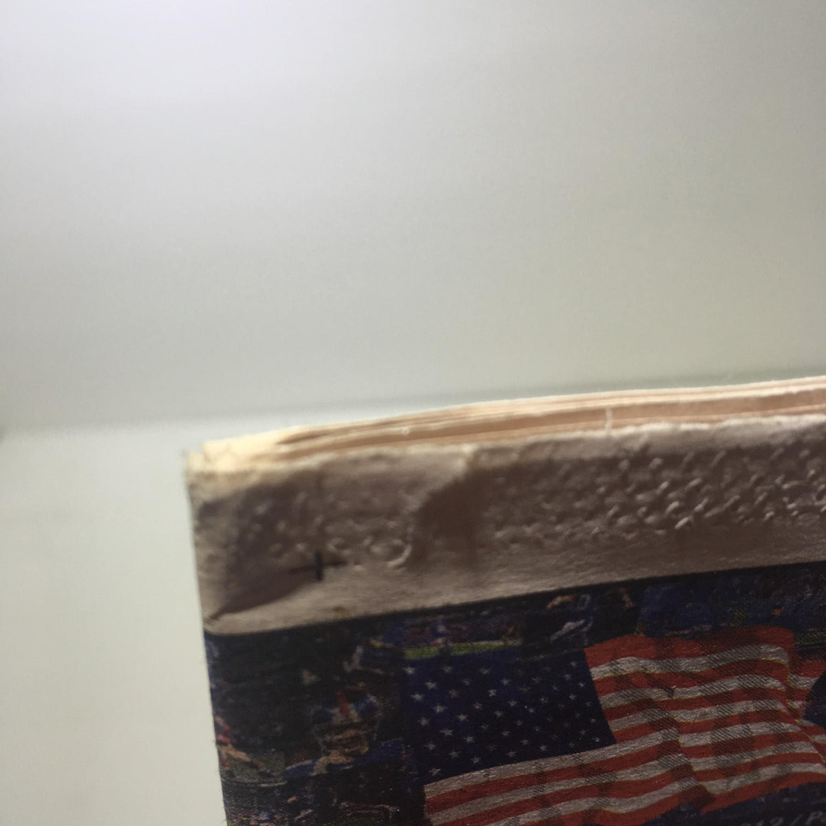 Close-up view of the top edge of the New York Post dated Feb 5 2012, titled 'Standing On The Shoulders Of Giants', showing mild wear.