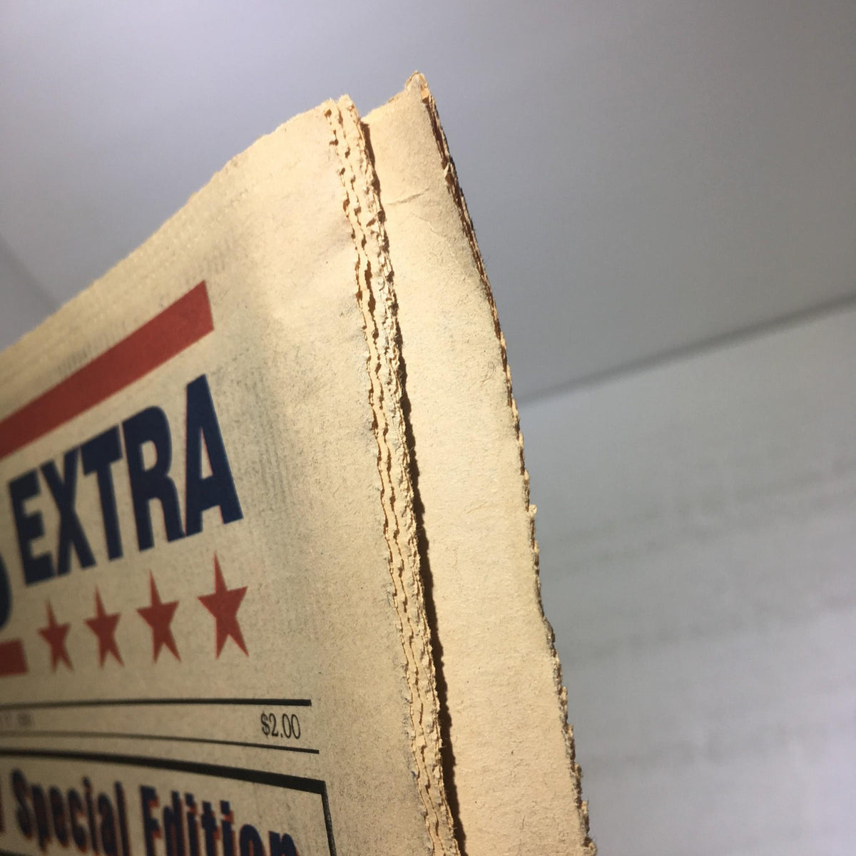 Side view of the Giants Extra newspaper showing its vintage condition, featuring wear and tear, dated February 17, 1991.