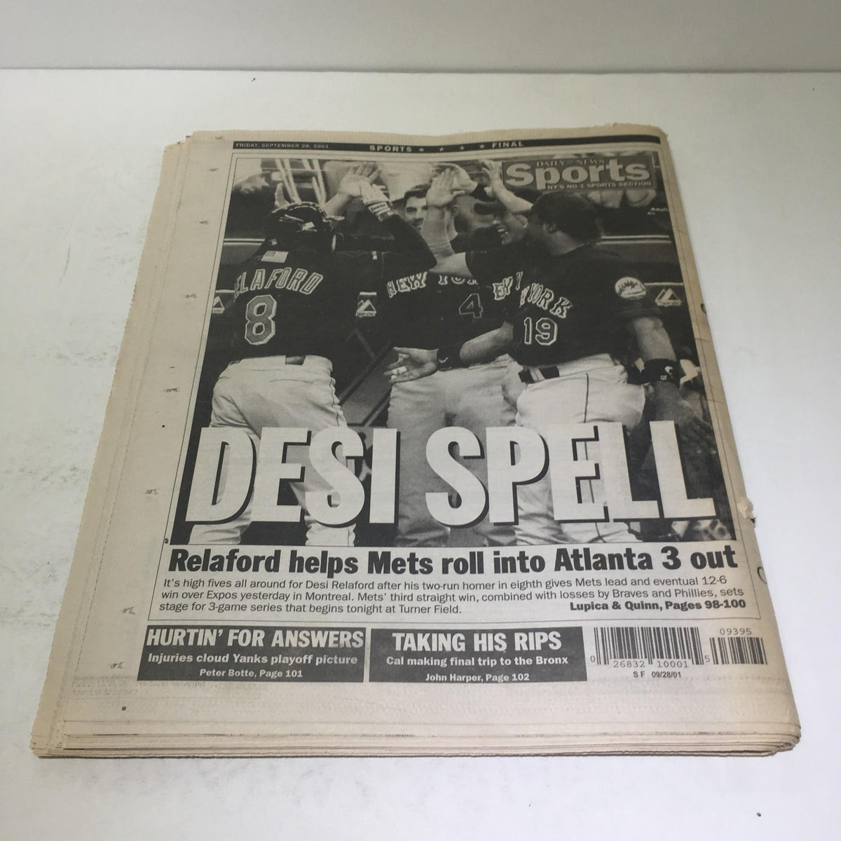 Vintage newspaper cover featuring a sports article titled 'DESI SPELL', detailing a game with the New York Yankees, highlighting player performance and playoff updates.