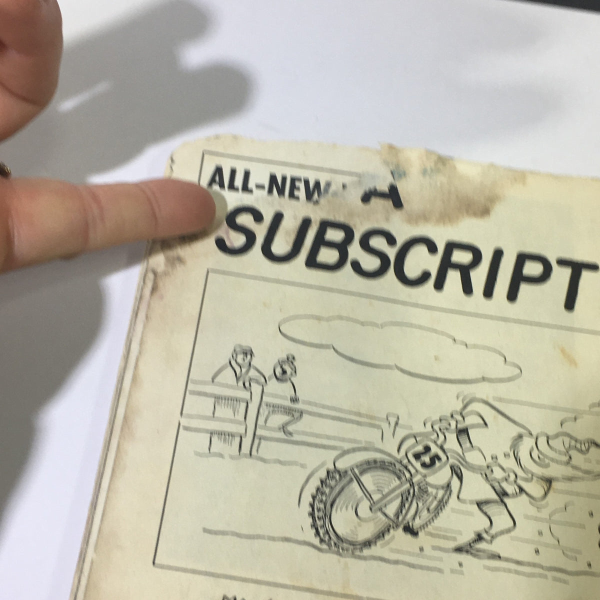 Closer view of the back cover of the December 1962 VTG Cycle Sport Magazine, showing a subscription advertisement with an illustration of a motorcycle racer.