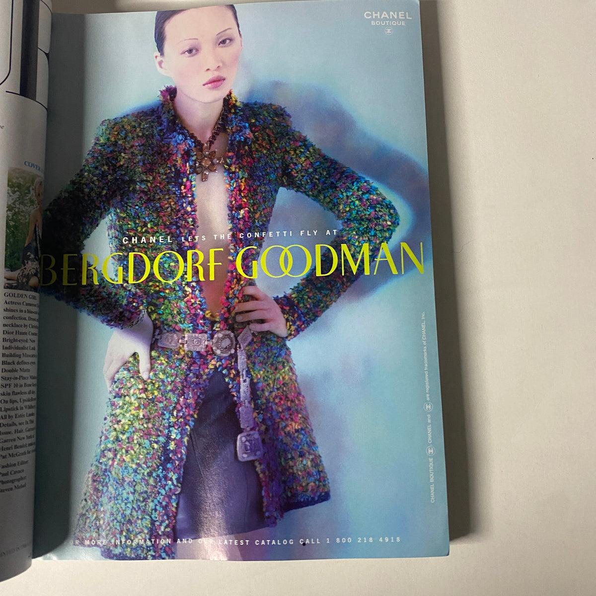 Vogue Magazine October 1997 displaying an advertisement for Bergdorf Goodman featuring a colorful Chanel coat design. The vibrant image emphasizes luxury fashion and beauty trends of the late 1990s.
