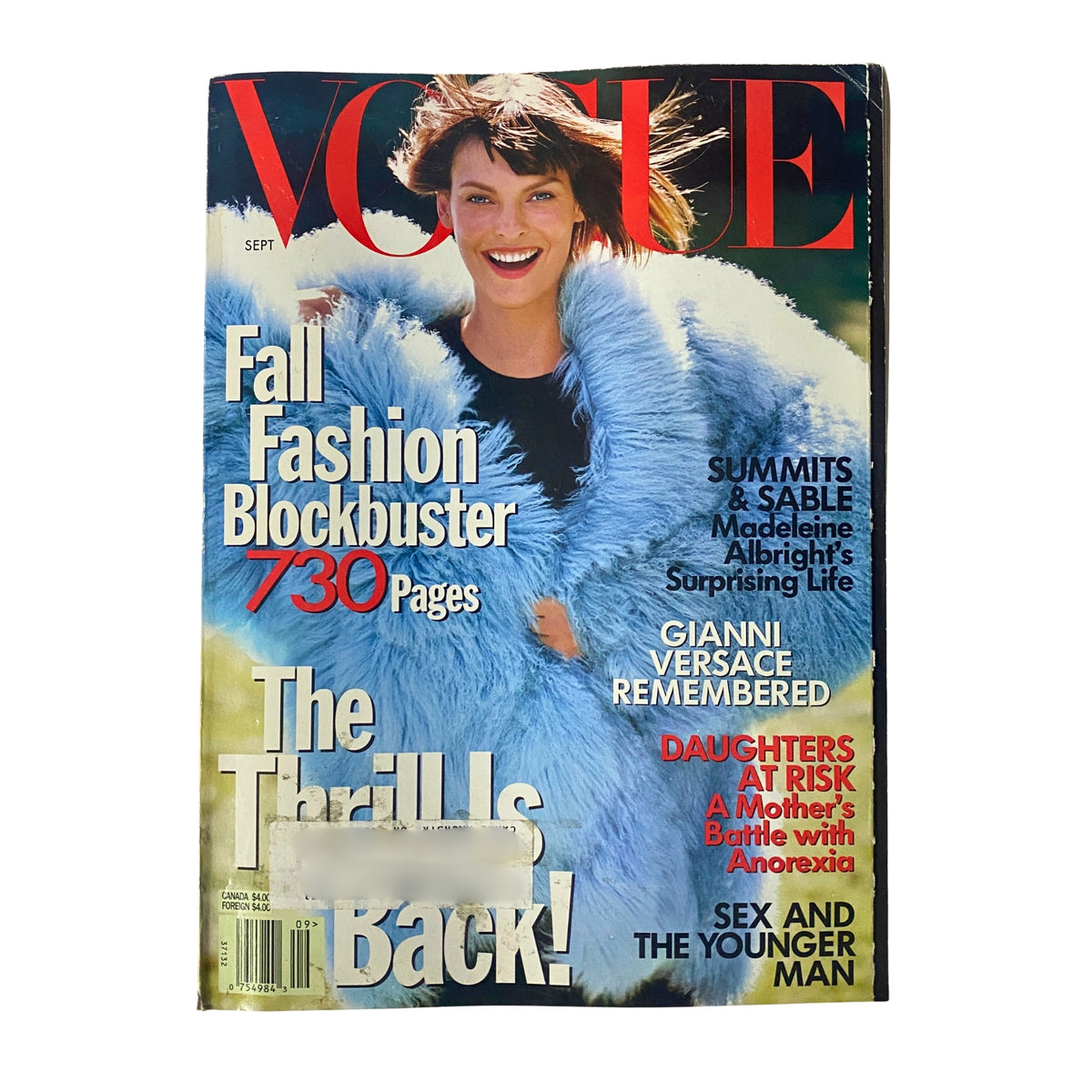 September 1997 Vogue Magazine featuring supermodel Linda Evangelista on the cover, styled in a fluffy blue coat, highlighting the fashion blockbuster and various feature articles.