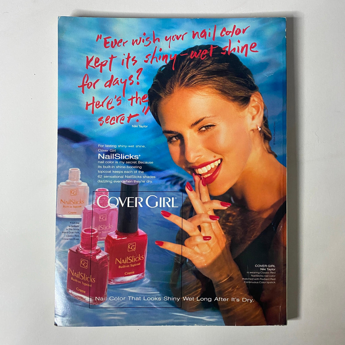 Vogue Magazine August 1994 includes a colorful advertisement for Cover Girl NailSlicks, displaying a glamorous model with vibrant nails and a beach backdrop.